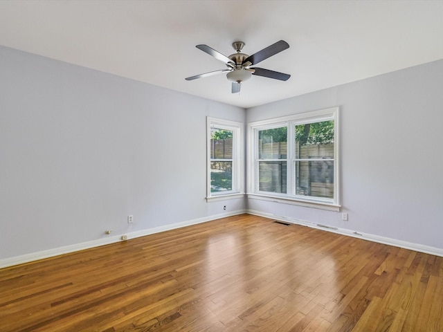 empty room with light hardwood / wood-style flooring and ceiling fan