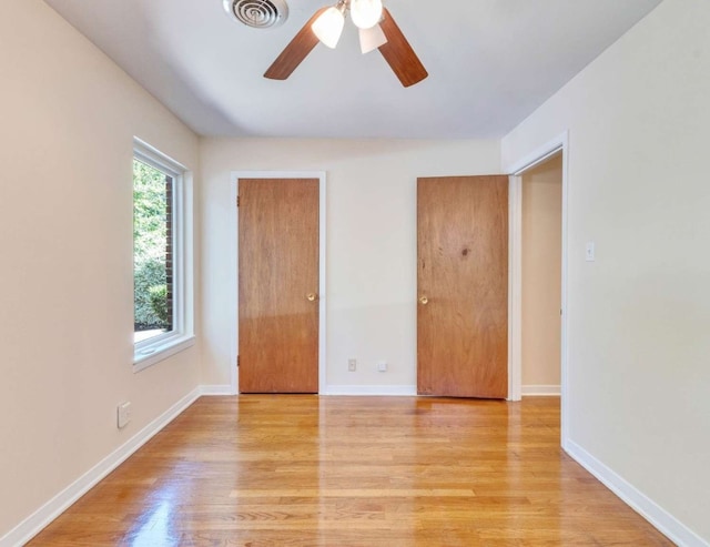 unfurnished room featuring light hardwood / wood-style floors and ceiling fan