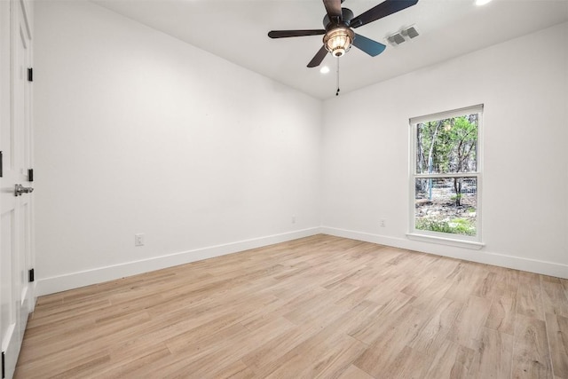 spare room featuring light wood finished floors, recessed lighting, visible vents, and baseboards