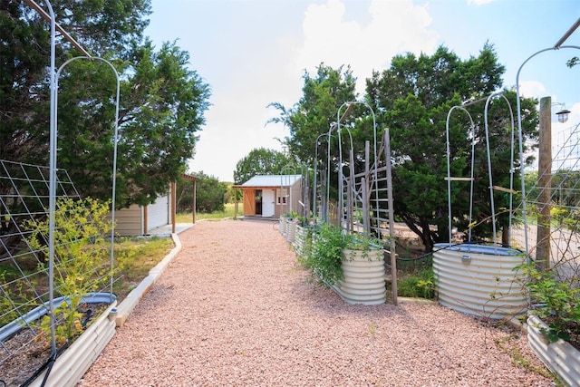 exterior space featuring a shed and an outbuilding