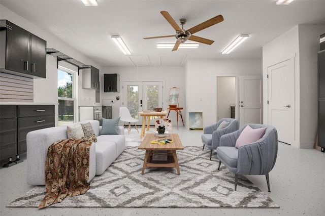 living room featuring a ceiling fan and french doors