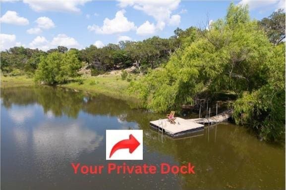 view of dock with a water view