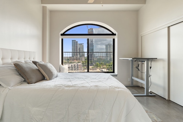 bedroom featuring concrete floors and ceiling fan