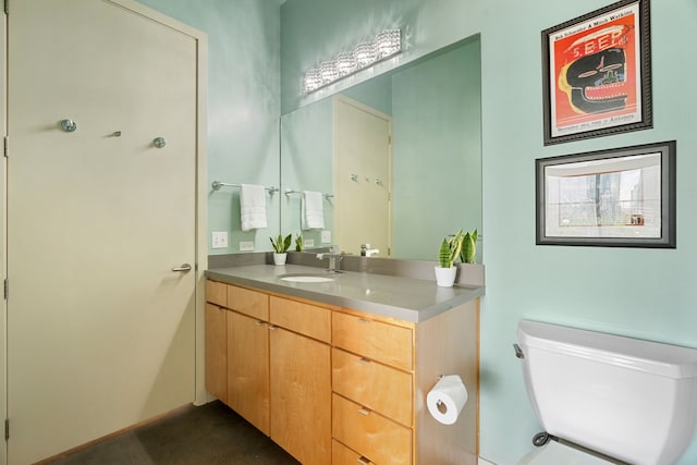 bathroom with toilet and vanity