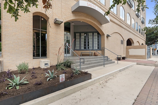 view of exterior entry featuring french doors