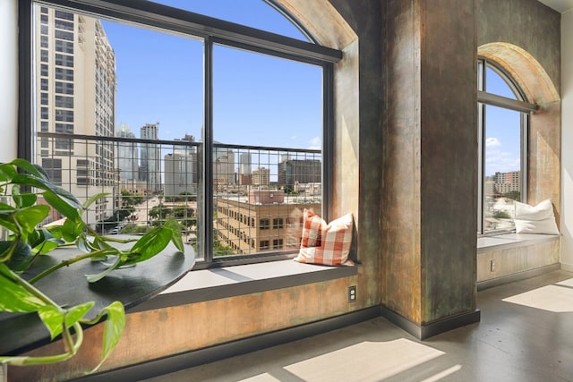 doorway with a healthy amount of sunlight and concrete floors