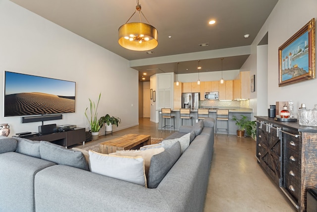 living room featuring a notable chandelier