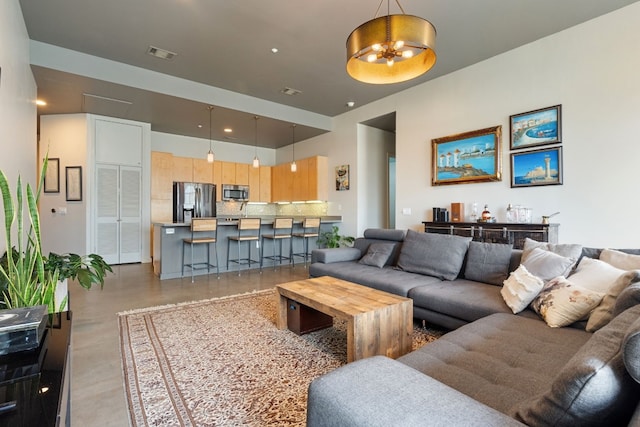 living room featuring an inviting chandelier