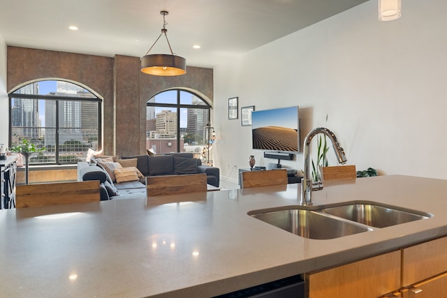 kitchen featuring sink and hanging light fixtures