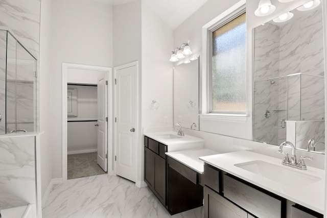 bathroom with a shower with shower door, vanity, and lofted ceiling