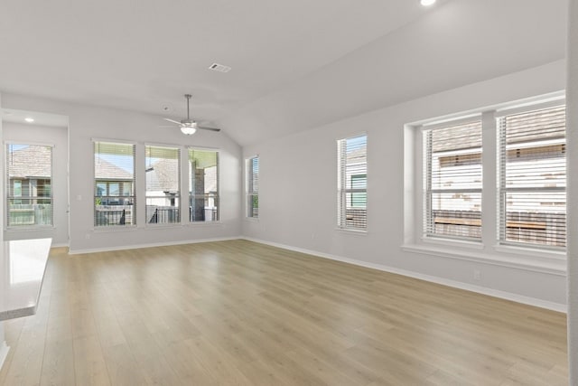 unfurnished living room featuring lofted ceiling, ceiling fan, and light hardwood / wood-style flooring