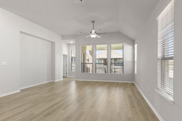 unfurnished living room with ceiling fan, lofted ceiling, and light hardwood / wood-style floors