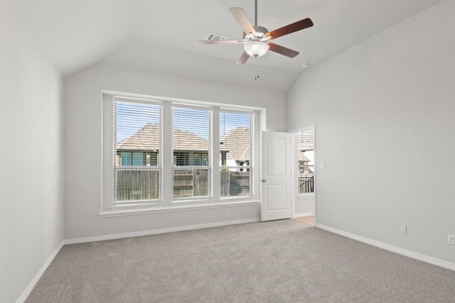 unfurnished room with ceiling fan, light colored carpet, and vaulted ceiling