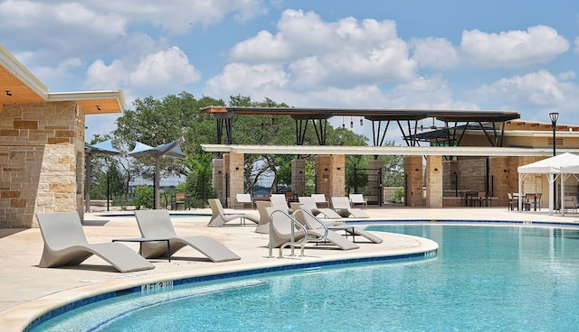 view of swimming pool with a patio area