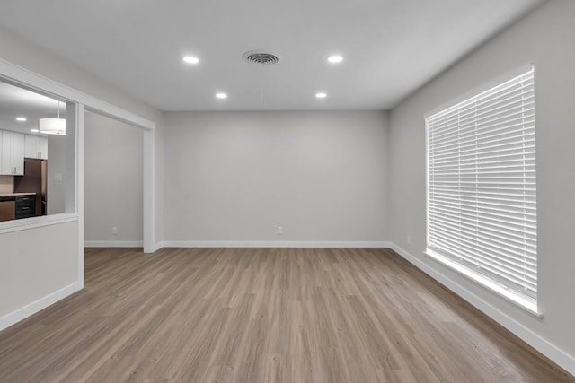 unfurnished living room featuring light hardwood / wood-style floors