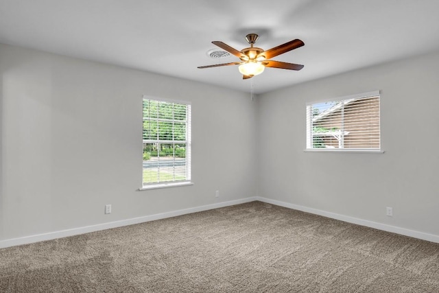 unfurnished room featuring carpet and ceiling fan