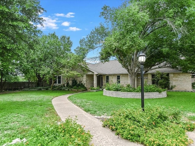 view of front facade with a front yard