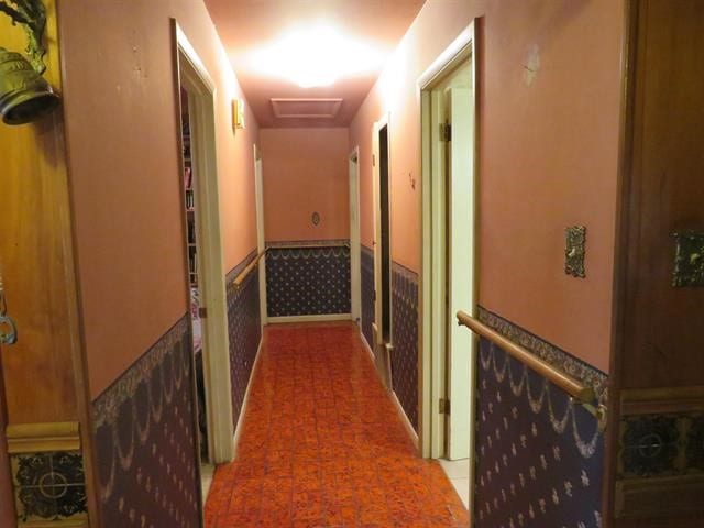 hallway with tile patterned floors