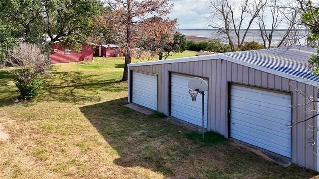 garage featuring a yard