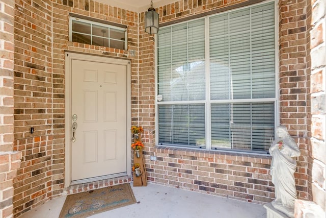 253 Lear Ave, Buda, TX 78610 - doorway to property with brick siding