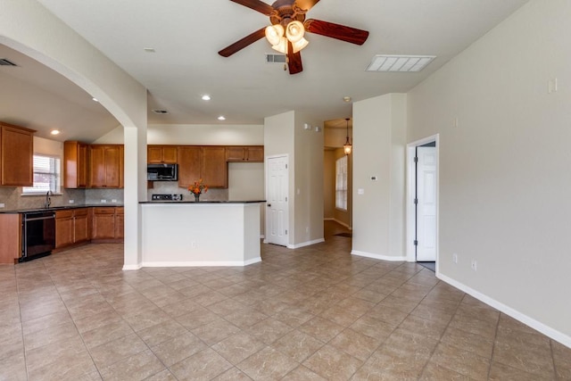253 Lear Ave, Buda, TX 78610 - kitchen featuring dishwashing machine, dark countertops, a ceiling fan, backsplash, and brown cabinets