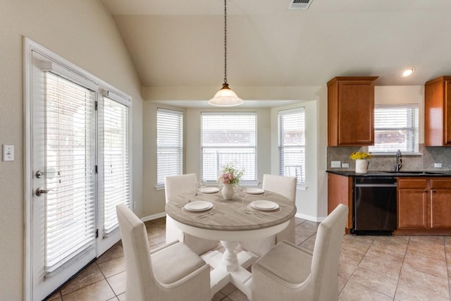 253 Lear Ave, Buda, TX 78610 - dining area with lofted ceiling and light tile patterned flooring