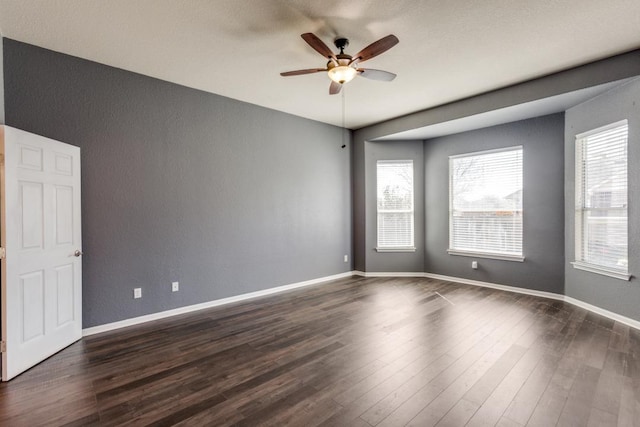 253 Lear Ave, Buda, TX 78610 - unfurnished room featuring a ceiling fan, dark wood-style floors, and a textured wall