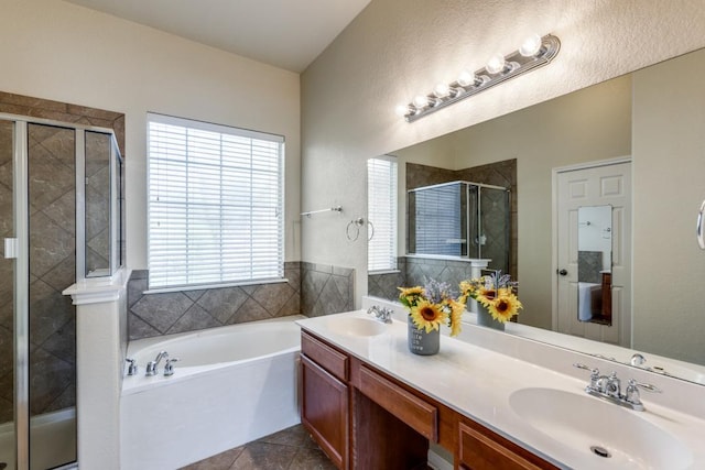 253 Lear Ave, Buda, TX 78610 - bathroom with a stall shower, a garden tub, double vanity, and tile patterned flooring
