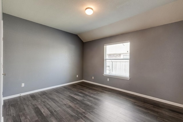 253 Lear Ave, Buda, TX 78610 - unfurnished room featuring dark wood finished floors and vaulted ceiling
