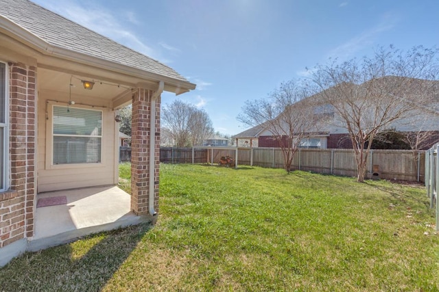 253 Lear Ave, Buda, TX 78610 - fenced backyard with a patio