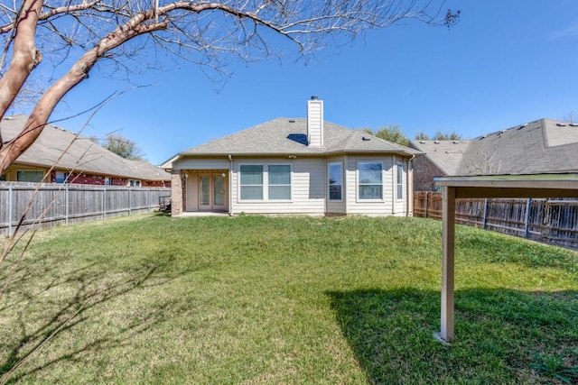 253 Lear Ave, Buda, TX 78610 - rear view of house featuring a chimney, a fenced backyard, and french doors