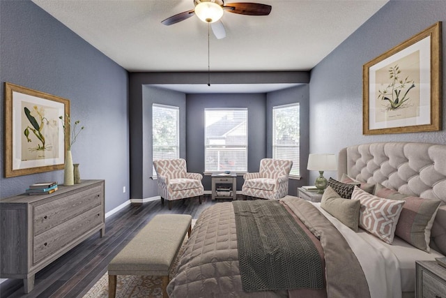 253 Lear Ave, Buda, TX 78610 - bedroom with a textured wall, dark wood-style flooring, and ceiling fan