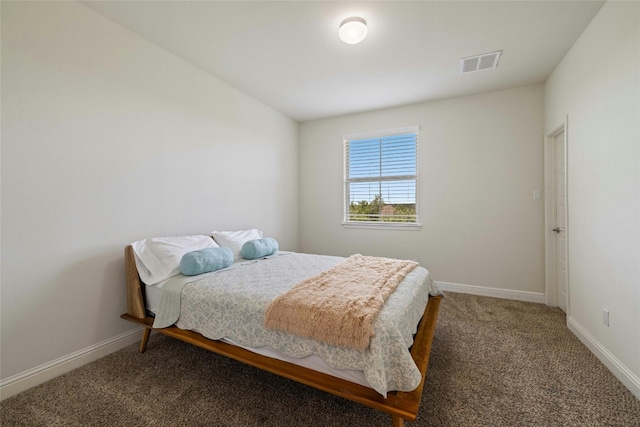 bedroom with baseboards, visible vents, and carpet floors