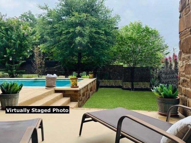 view of patio featuring a fenced in pool and a fenced backyard