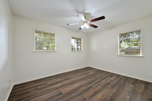 empty room featuring dark hardwood / wood-style floors and ceiling fan