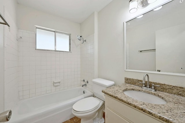 full bathroom featuring vanity, toilet, and tiled shower / bath combo