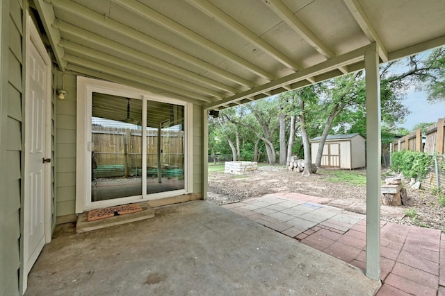 view of patio / terrace with a storage shed