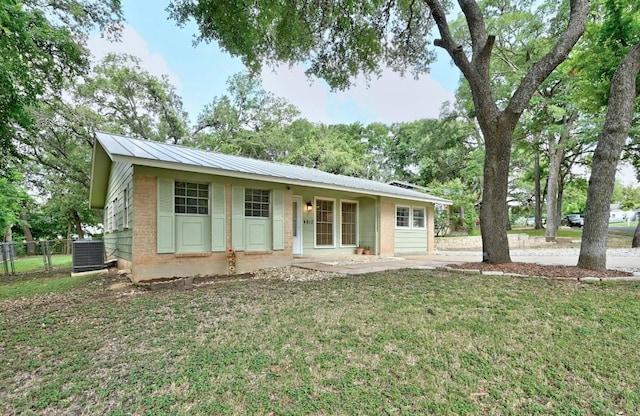 ranch-style house with a front yard, a porch, and central AC