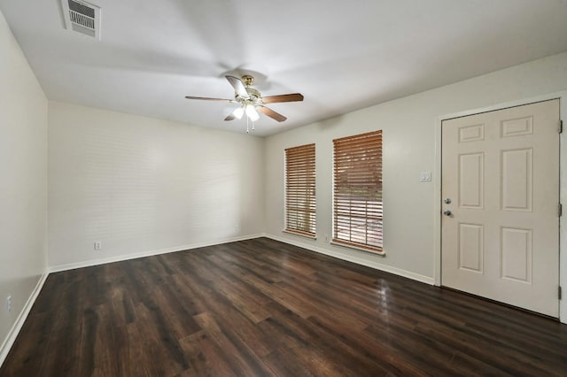 unfurnished room featuring ceiling fan and dark hardwood / wood-style flooring