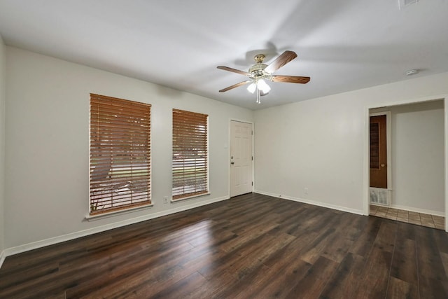 unfurnished room featuring dark hardwood / wood-style floors and ceiling fan