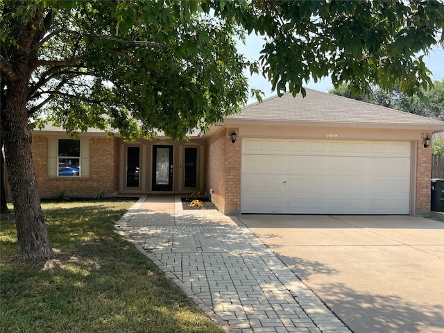 single story home with a garage