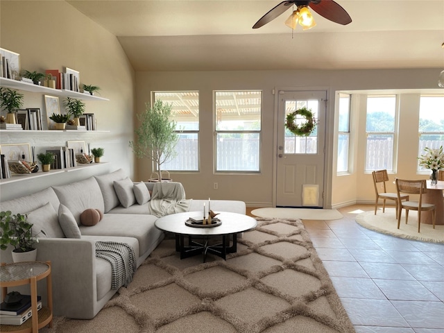 tiled living room featuring vaulted ceiling and ceiling fan