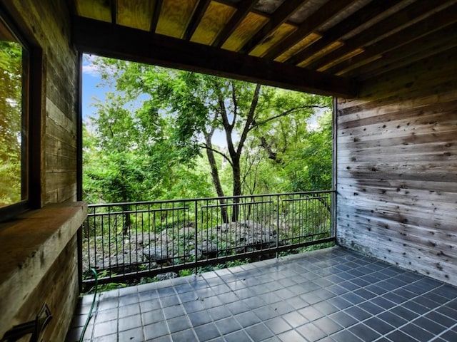 view of patio featuring a balcony