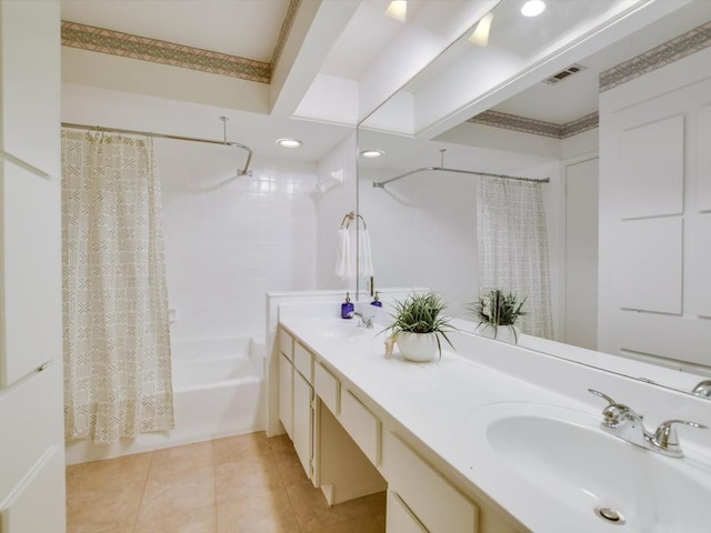 bathroom featuring tile patterned flooring, vanity, crown molding, and shower / bath combo with shower curtain