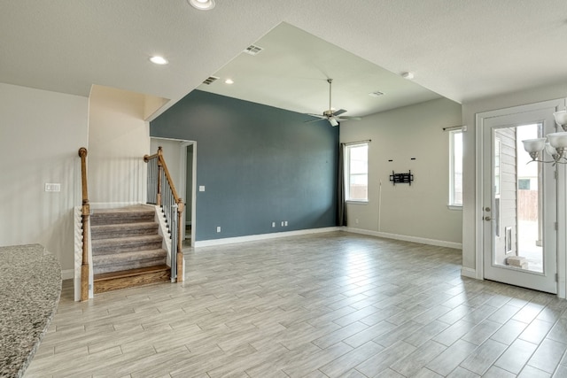 interior space with ceiling fan, light hardwood / wood-style floors, and a textured ceiling