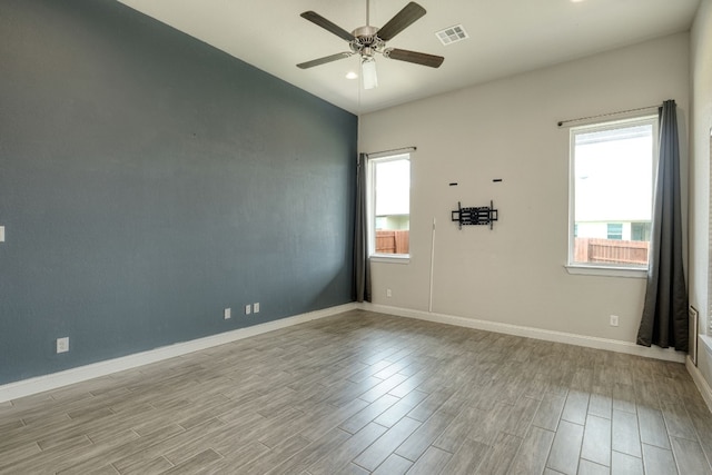 unfurnished room featuring ceiling fan and light hardwood / wood-style floors