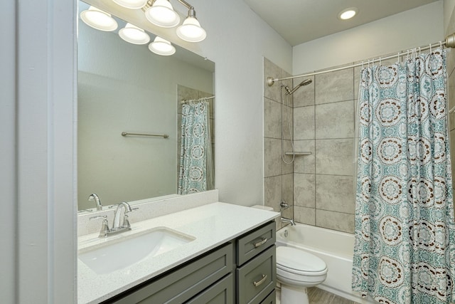 full bathroom with vanity, toilet, and shower / bath combo with shower curtain