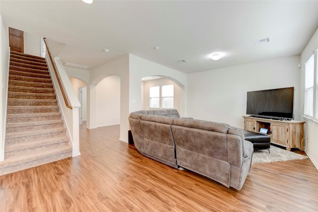 living room with light hardwood / wood-style flooring