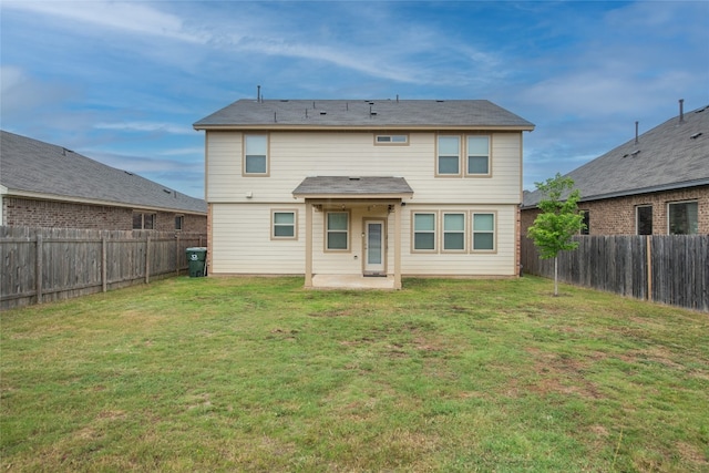 228 Durata Dr, San Marcos, TX 78666 - rear view of house with a fenced backyard and a patio area
