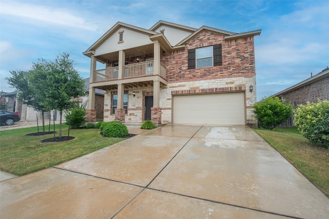 view of front of property with a garage, a balcony, and a front yard